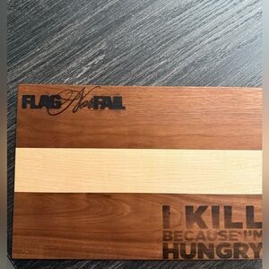 Flag Nor Fail cutting board with kitchen towel